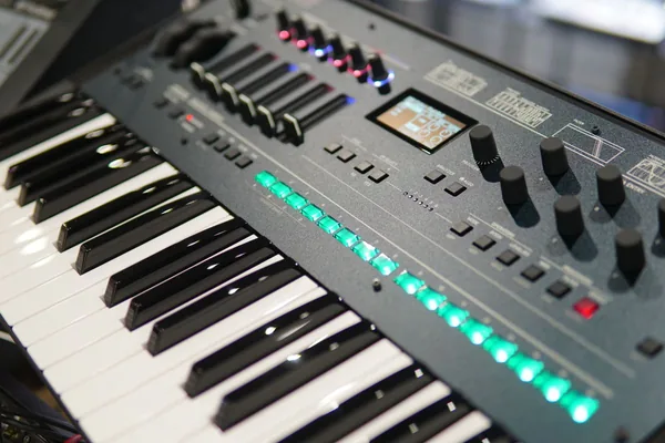 Virtual synth online — mini synthesizer keys and knobs close-up
